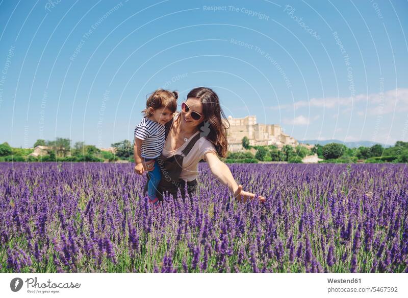 France, Grignan, mother and little daughter having fun together in lavender field Fun funny mommy mothers ma mummy mama daughters parents family families people