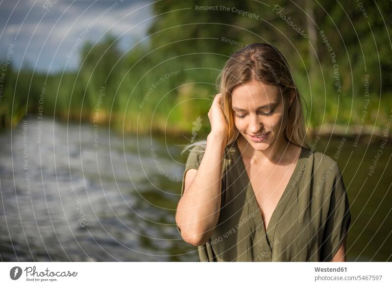 Woman standing at a lake human human being human beings humans person persons caucasian appearance caucasian ethnicity european 1 one person only