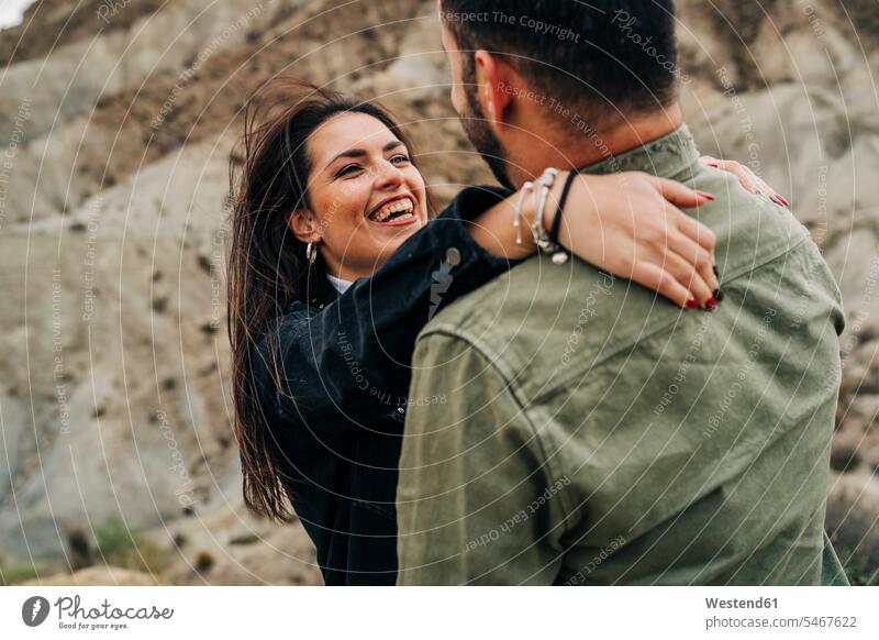 Happy young couple embracing in rural landscape, Almeria, Andalusia, Spain human human being human beings humans person persons caucasian appearance