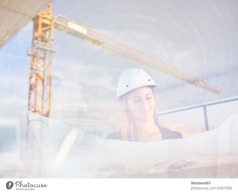 Female architect on construction site checking blueprint construction plan building plan architectural drawing female architect architects female architects