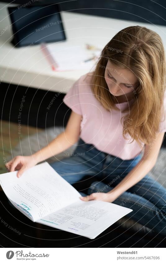 Blond girl learning at home read human human being human beings humans person persons 1 one person only only one person children kid kids female females girls