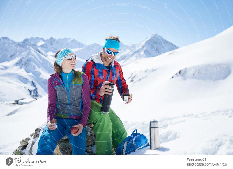 Happy youple of ski tourers having a break in the mountains, Kuehtai, Tyrol, Austria Eye Glasses Eyeglasses specs spectacles Pair Of Sunglasses sun glasses