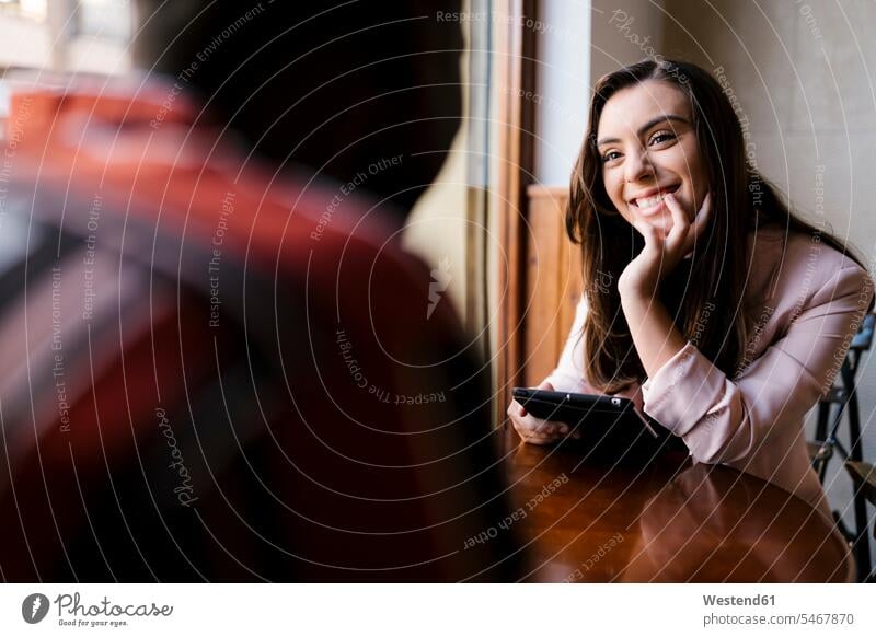 Smiling young woman talking with boyfriend in cafe color image colour image day daylight shot daylight shots day shots daytime indoors indoor shot indoor shots