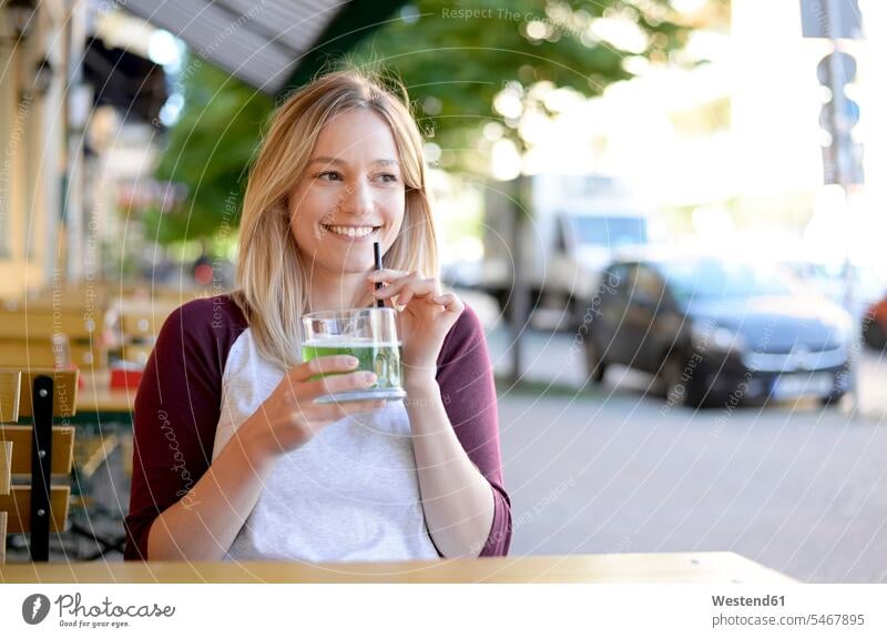 Blond young woman drinking 'Berliner Weisse' in beer garden break smiling smile Beer Beers Ale females women Alcohol alcoholic beverage Alcoholic Drink