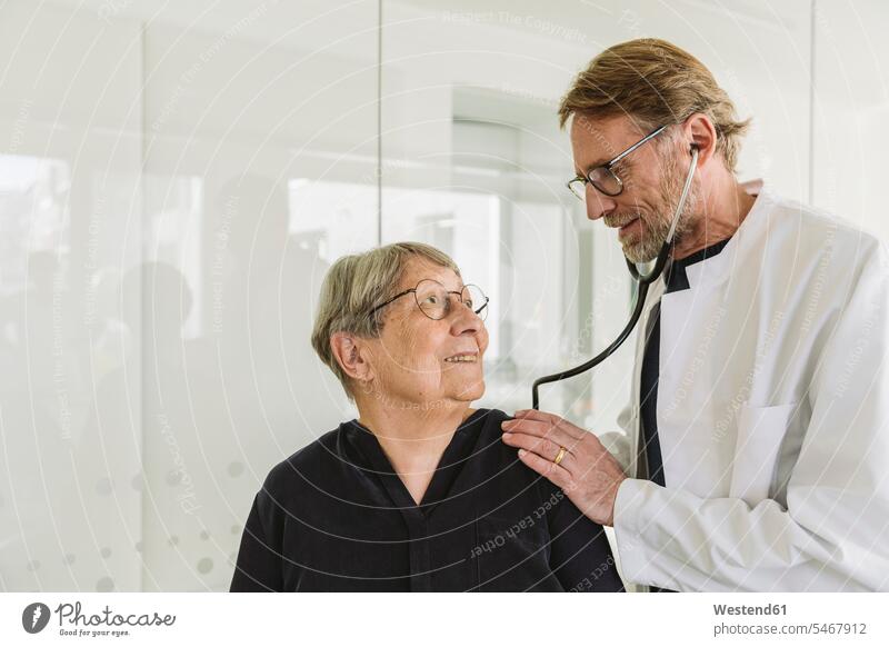 Doctor examining senior patient in medical practice health healthcare Healthcare And Medicines medicine disease diseases ill illnesses sick Sickness patients