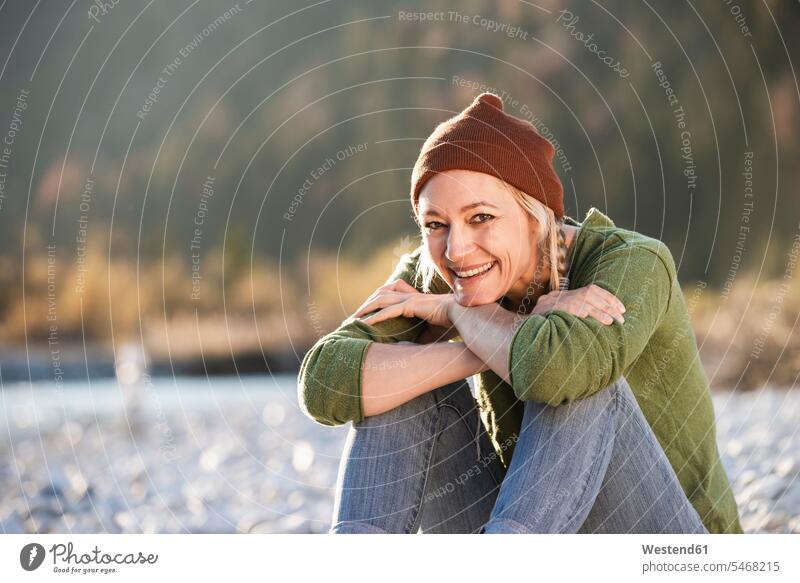 Portrait of smiling mature woman smile camping portrait portraits woolly hat Wooly Hat Knit-Hat Knit Hats wool cap Adventure adventurous Adventures females