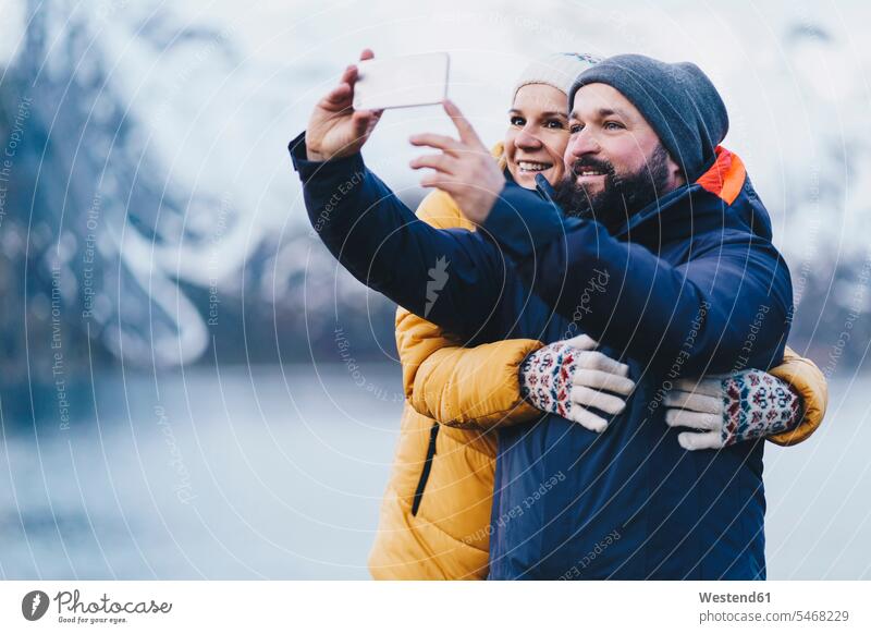 Tourist couple taking a selfie at Hamnoy, Lofoten, Norway human human being human beings humans person persons caucasian appearance caucasian ethnicity european