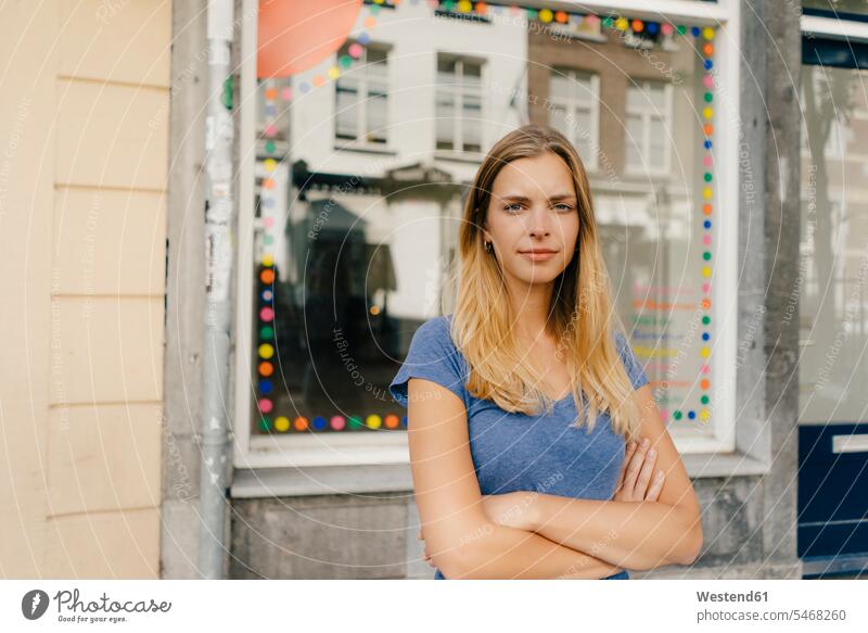 Netherlands, Maastricht, portrait of blond young woman in the city blond hair blonde hair town cities towns females women portraits people persons human being