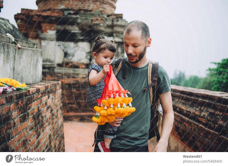 Thailand, Ayutthaya, father and little daughter bringing offerings at Wat Yai Chaya Mongkhon temple complex temples daughters pa fathers daddy papa
