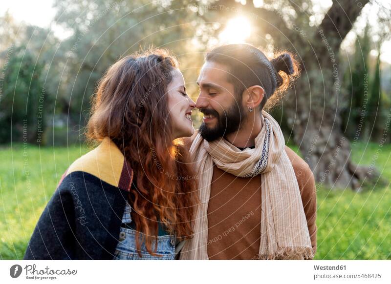 Happy young couple kissing in the countryside human human being human beings humans person persons caucasian appearance caucasian ethnicity european 2 2 people