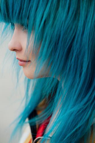 Young woman with dyed blue hair, close-up females women coloured Adults grown-ups grownups adult people persons human being humans human beings colours