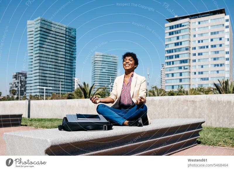 Businesswoman sitting on bench and meditating human human being human beings humans person persons Mixed Race mixed race ethnicity mixed-race Person 1