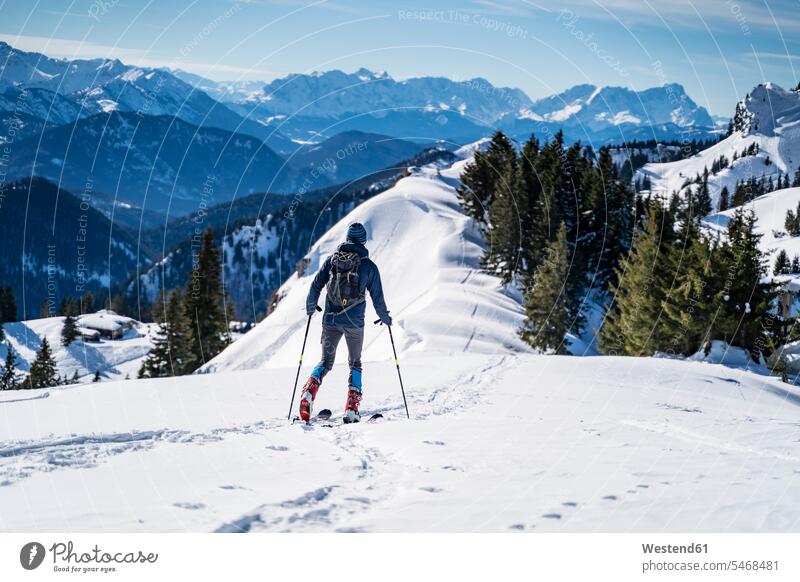 Germany, Bavaria, Brauneck, man on a ski tour in winter in the mountains hibernal men males Ski Touring ski tours mountainscape mountainscapes mountain scenery