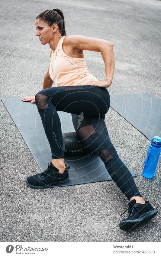 Sportive woman training with fascia roll athlete sportswoman athletes female athlete sportswomen female athletes females sportive sporting sporty athletic