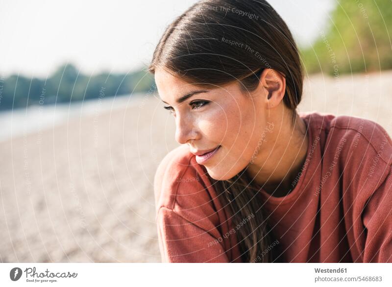 Portrait of smiling young woman outdoors smile portrait portraits females women Adults grown-ups grownups adult people persons human being humans human beings