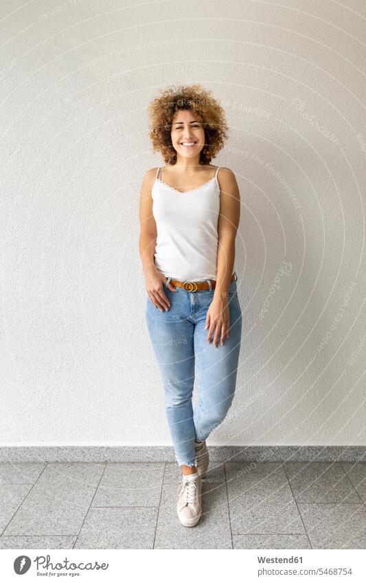 Smiling mid adult woman wearing jeans human human being human beings humans person persons caucasian appearance caucasian ethnicity european 1 one person only