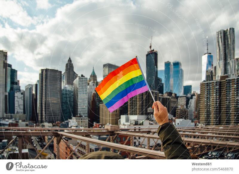 Gay flag with New York in the background, USA touristic tourists flags banner banners gay homosexually queer same-sex gay man gay men homosexual man