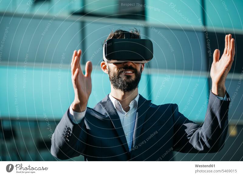 Businessman using virtual reality glasses outside office building office buildings specs Eye Glasses spectacles Eyeglasses VR Business man Businessmen