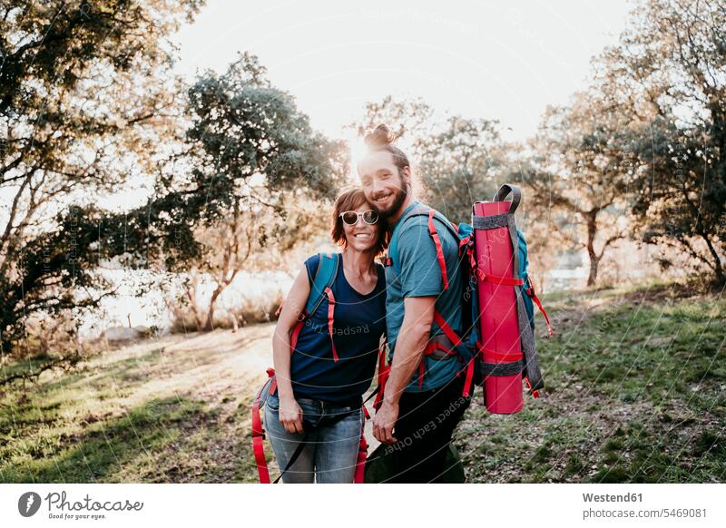 Happy couple with backpacks on a hiking trip human human being human beings humans person persons caucasian appearance caucasian ethnicity european 2 2 people