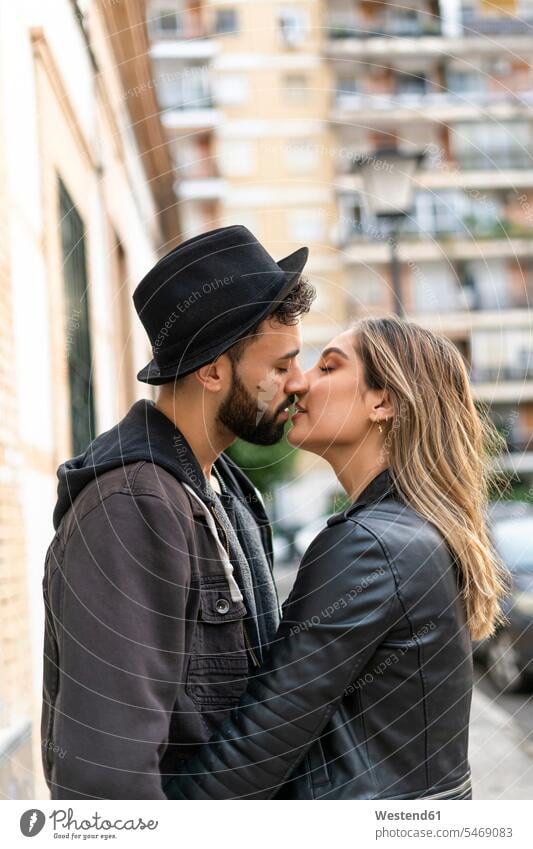 Young couple kissing in the city human human being human beings humans person persons caucasian appearance caucasian ethnicity european 2 2 people 2 persons two