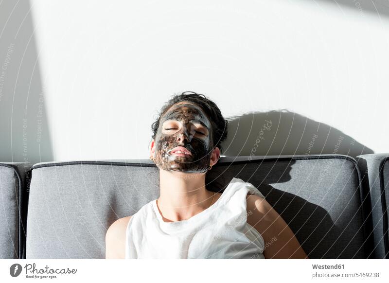 Relaxed young woman wearing facial mask at home human human being human beings humans person persons caucasian appearance caucasian ethnicity european 1