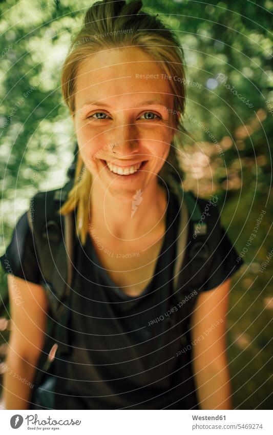 Portrait of smiling young woman on a hiking trip smile females women hiking tour walking tour portrait portraits Adults grown-ups grownups adult people persons