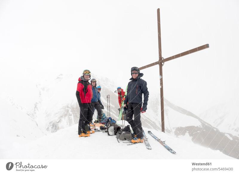 Georgia, Caucasus, Gudauri, peeope at summit cross on a ski tour nature experience peak mountain peak mountain peaks Traveller Travellers Travelers