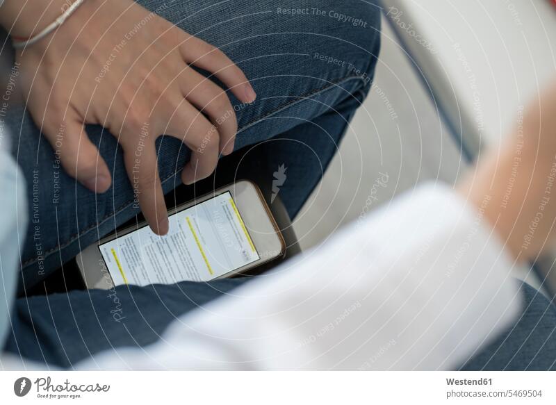 Crop view of student scrolling smartphone trying to copy an exam human human being human beings humans person persons caucasian appearance caucasian ethnicity