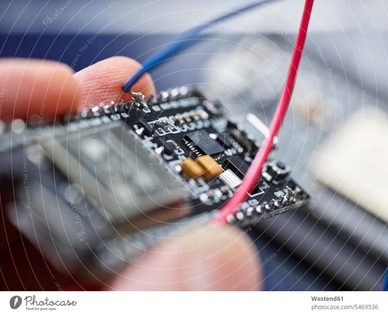 Detail of hand holding circuit board human human being human beings humans person persons caucasian appearance caucasian ethnicity european 1 one person only
