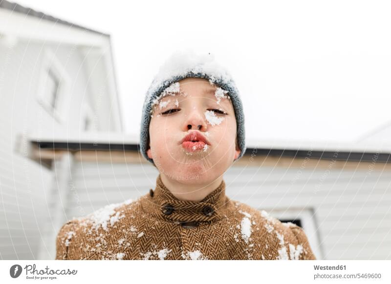 Portrait of boy with snow in his face human face human faces boys males portrait portraits head heads child children kid kids people persons human being humans