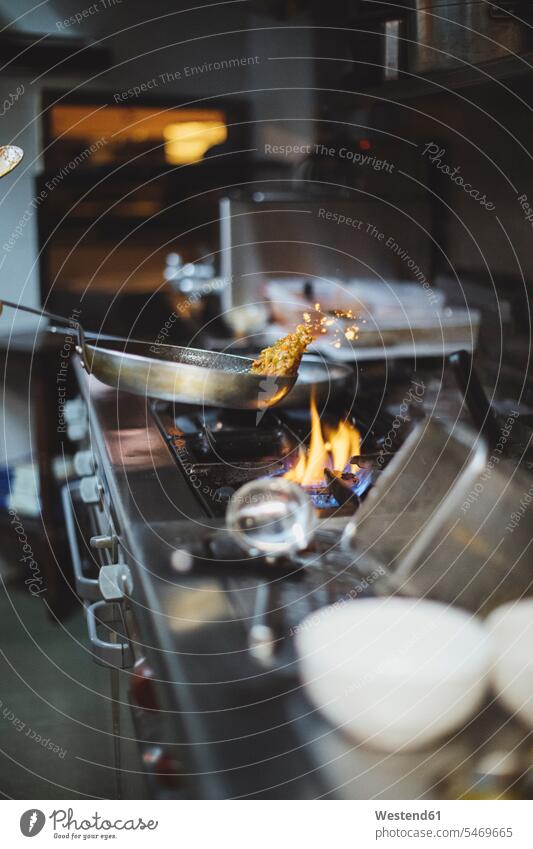 Preparing a dish at gas stove in restaurant kitchen devices Cookers Gas Stove Burner Gas Stoves fry roast roasting cook Blaze Occupation Work traditional