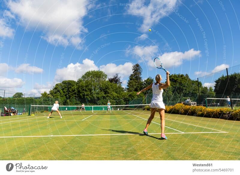 Mature women during a tennis match on grass court human human being human beings humans person persons caucasian appearance caucasian ethnicity european Group