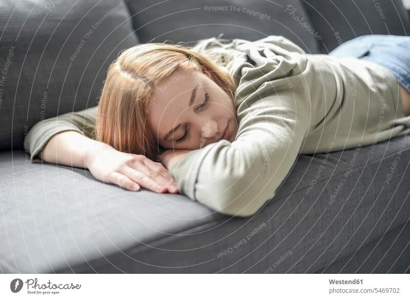 Portrait of blond young woman napping on the couch human human being human beings humans person persons caucasian appearance caucasian ethnicity european 1
