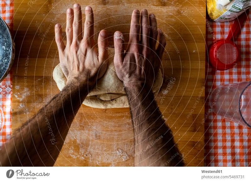 Man's hands kneading dough, top view human human being human beings humans person persons caucasian appearance caucasian ethnicity european 1 one person only