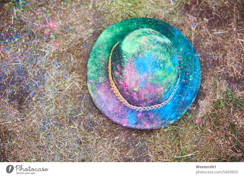 Hat with colour powder on the grass Powder Paint Flower Power hat hats powders multi-coloured multicoloured multi colored Multi Coloured colorful color powder