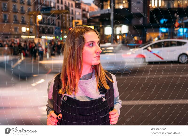 Young woman standing at night in the city on the street human human being human beings humans person persons caucasian appearance caucasian ethnicity european 1