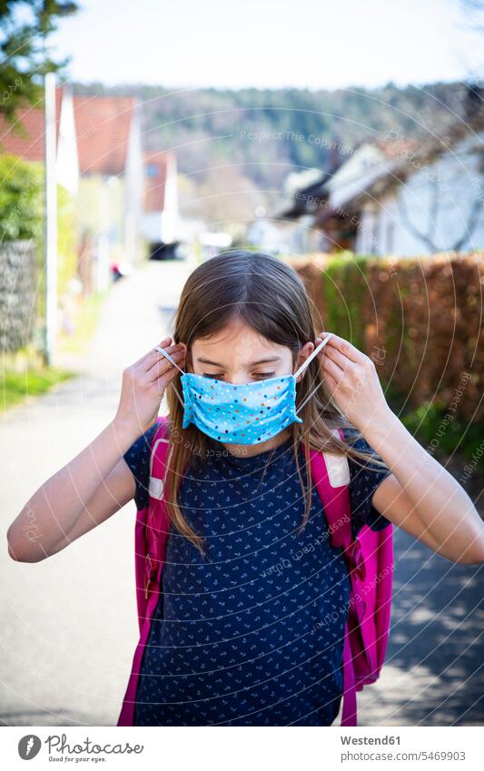 Girl with homemade protective mask on her way to school human human being human beings humans person persons 1 one person only only one person children kid kids