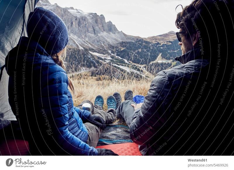 Couple sitting in tent in the mountains looking at view View Vista Look-Out outlook tents couple twosomes partnership couples Seated people persons human being
