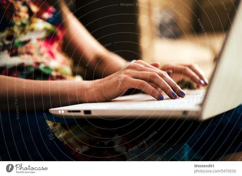 Close-up of woman's hands using laptop at home color image colour image indoors indoor shot indoor shots interior interior view Interiors sitting Seated working