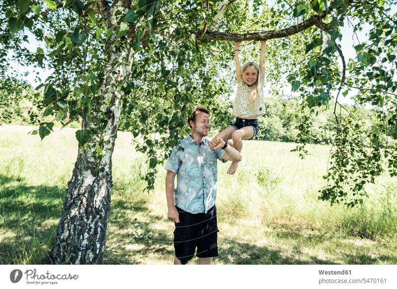 Father checking the time with daughter hanging on a branch of a birch tree watches wrist watches Wristwatch Wristwatches exercise practising train training