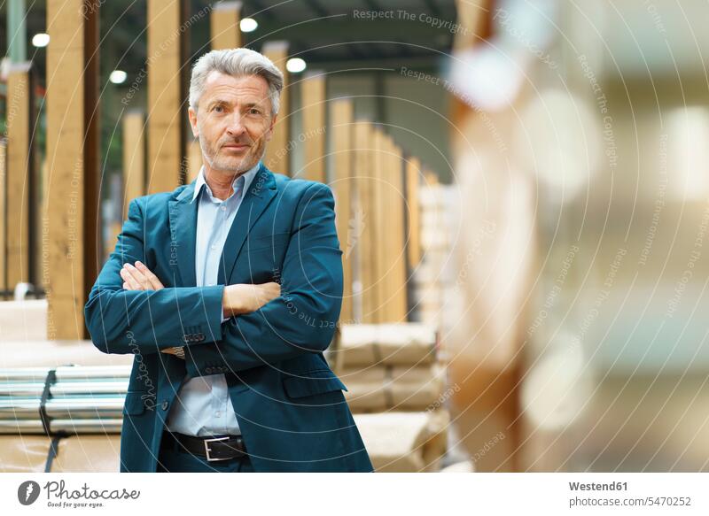 Portrait of a confident mature businessman in a factory Occupation Work job jobs profession professional occupation business life business world business person
