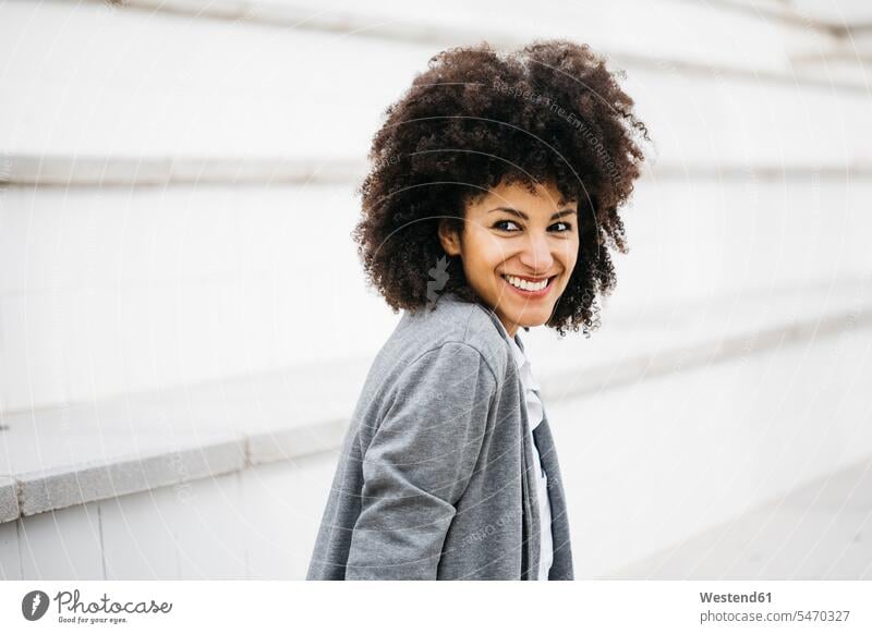 Portrait of laughing woman with curly hair females women portrait portraits Laughter Adults grown-ups grownups adult people persons human being humans