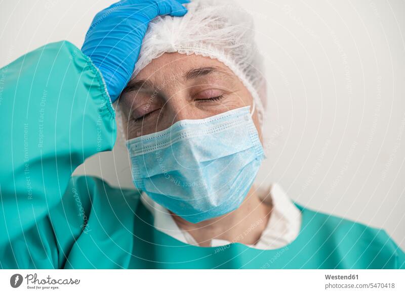 Portrait of exhausted woman wearing personal protective equipment Occupation Work job jobs profession professional occupation health healthcare