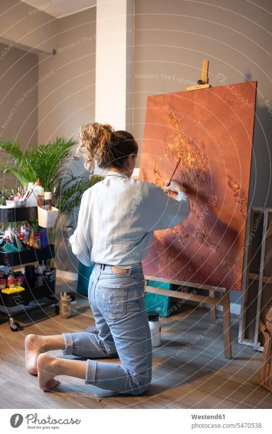Young woman painting in her atelier Atelier Art Studio females women Adults grown-ups grownups adult people persons human being humans human beings