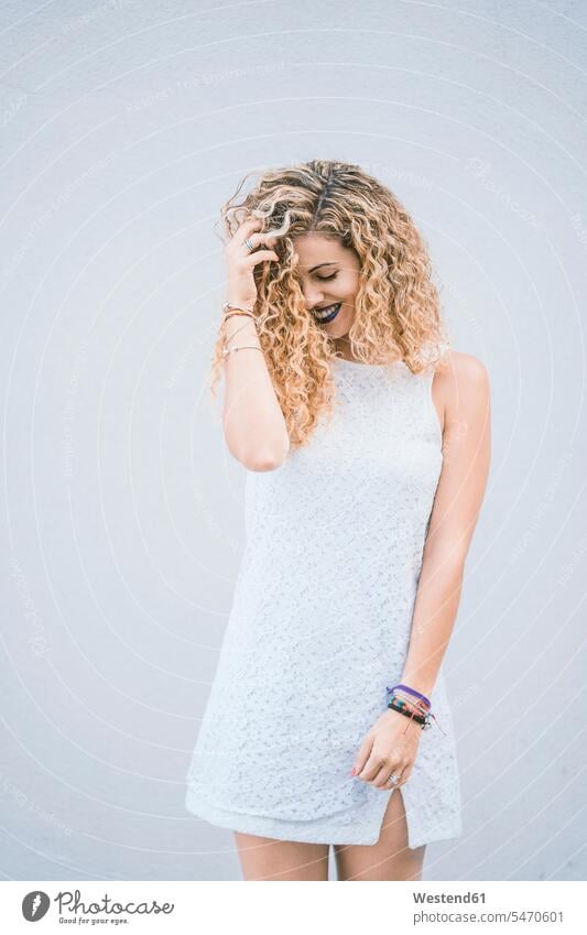 Portrait of smiling young woman with blond ringlets wearing white summer dress lacey smile colour colours White Colors stand free time leisure time Lifestyle