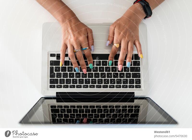 Close-up of woman hands using laptop on table at home color image colour image Spain indoors indoor shot indoor shots interior interior view Interiors