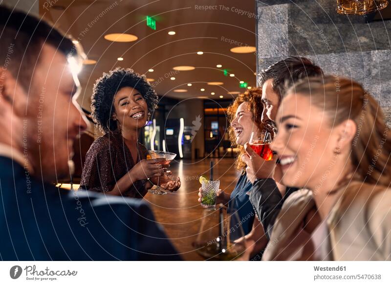 Happy friends socializing in a bar human human being human beings humans person persons caucasian appearance caucasian ethnicity european African black
