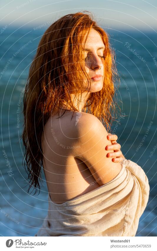 Portrait of redheaded young woman with nose piercing in front of the sea caucasian caucasian ethnicity caucasian appearance european eroticism sexuality evening