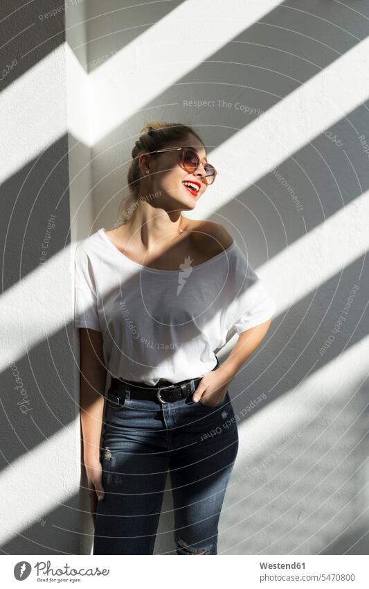 Portrait of laughing young woman with red lips and sunglasses human human being human beings humans person persons caucasian appearance caucasian ethnicity