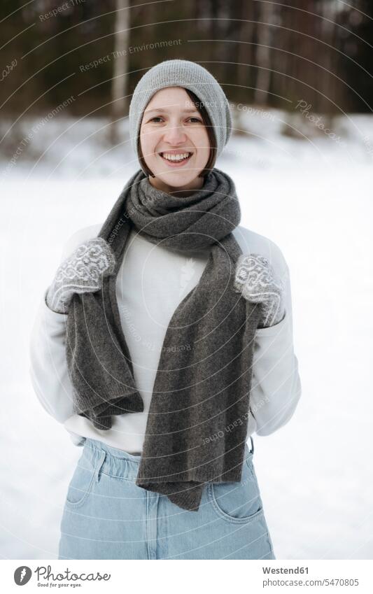 Portrait of happy woman standing on a snow field human human being human beings humans person persons caucasian appearance caucasian ethnicity european 1